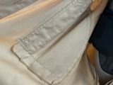 a close up of a suit case with a tie on it