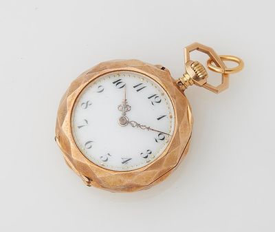 an image of a gold pocket watch on a white surface