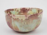 a bowl that is sitting on a white surface