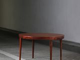 a small wooden table sitting on the floor in a room