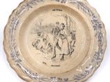 a plate with a drawing of a man and a dog on it