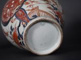 a close up of a vase on a black surface