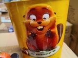 a cup that has a picture of a beaver on it