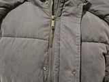 a jacket on a mannequin display in a store