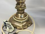 a lamp that is sitting on a table next to a cord