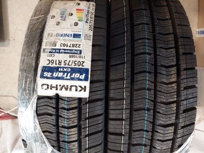 tires on display in a shop with a price tag attached to them