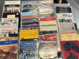 a lot of music cds and cds on the table
