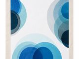 a blue and white abstract painting of circles on a white background