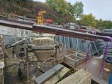 a crane that is sitting on top of a pile of metal