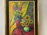a painting of a vase of flowers on a easel