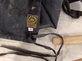 a bag and a baseball bat sitting on a table