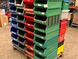 a stack of bins on a pallet in a warehouse