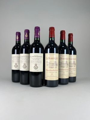 six bottles of wine lined up in a row on a table