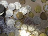 a lot of coins that are on the table