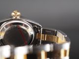 a close up of a watch on a table