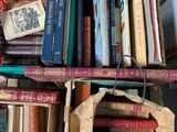 a lot of books that are sitting on a shelf