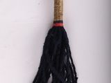 a black rope with a tassel hanging from it