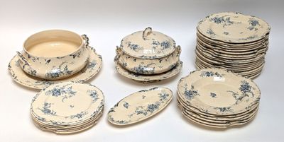 a lot of plates and bowls that are sitting on a table