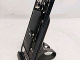 a cell phone that is sitting on top of a stand