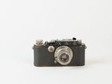 a small camera that is sitting on a white surface