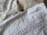 a woman that is laying in bed with a blanket