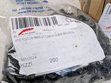 a package of screws in a bag on a table