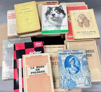 a lot of books that are stacked on top of each other