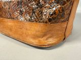 a brown bag with a snake skin pattern on it