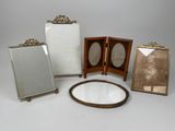 several different types of mirrors are arranged on a white surface