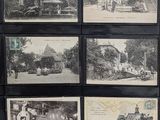 several black and white photographs of old buildings in a display case