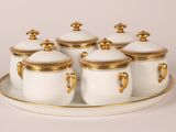 six white and gold sugar and creamer set on a tray