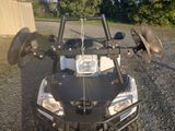 a close up of the front end of a four wheeler atv