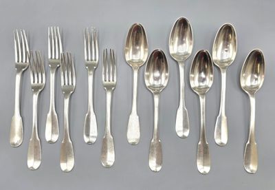 a lot of silver spoons and forks on the table