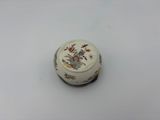 an image of a close up of a small bowl on a white surface