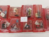 a lot of action figures that are in plastic cases