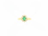 an emerald and diamond ring