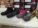 five pairs of shoes on a table in a store