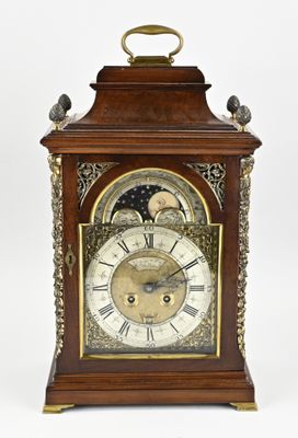 a clock that is sitting on top of a table
