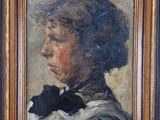 tableau représentant une femme portant un nœud papillon noir, dans un cadre en bois