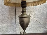 a lamp that is sitting on a table with a lamp shade on it