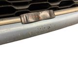 a close up of a car ' s grille with the word vapour on it