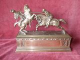 bronze statue of a man on a horse and a man on a horse with a spear