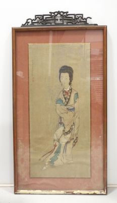 framed picture of a woman in a kimono sitting on a chair