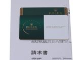 a picture of a rolex credit card on a piece of paper