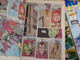 a comic book open on a table with comics on it