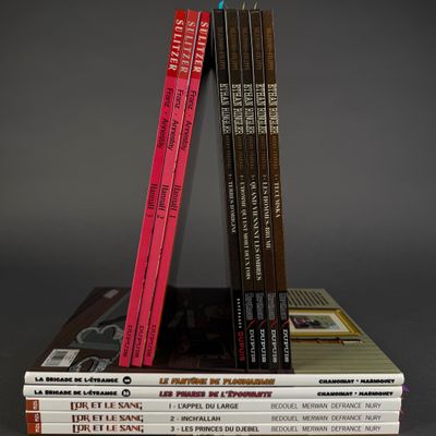 several books are stacked on top of each other on a table
