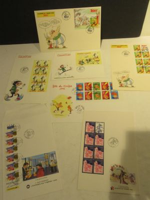 a lot of postcards and stamps on the table