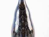 a blue vase with a black design on it