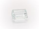 a close up of a faceted aquamarine stone on a white background