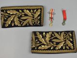 pair of black and gold embroidered purses with gold leaf design